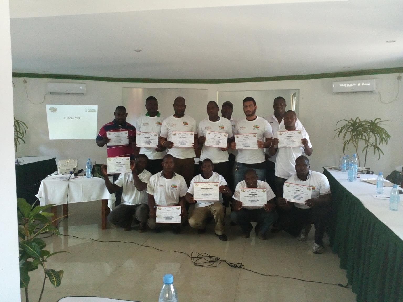 Graduates with their certificates