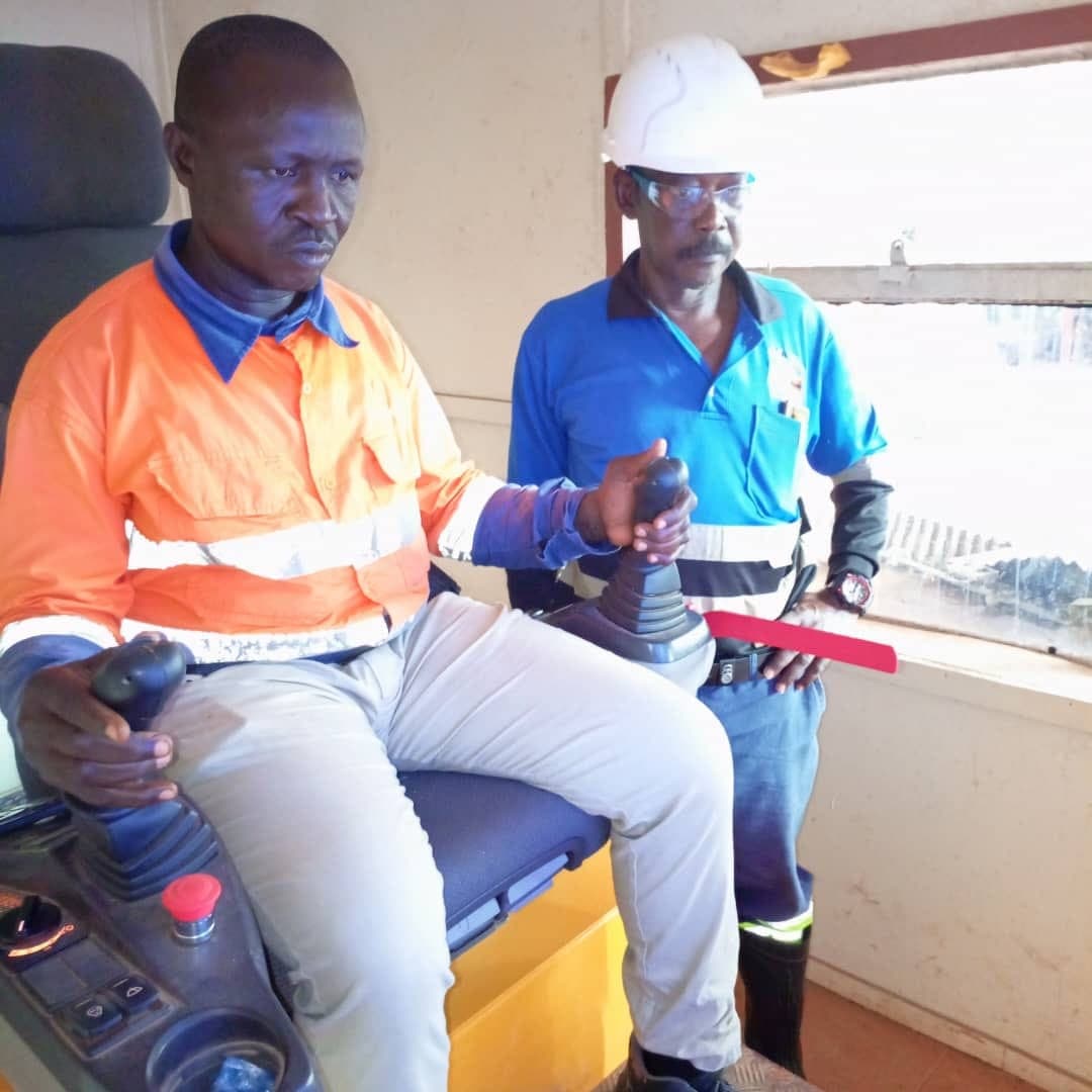 Instructor guiding a practical driver-training exercise